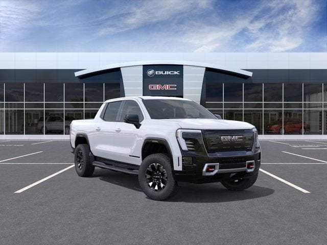 2026 GMC Sierra EV AT4 Extended Range in Summit White — front three-quarter view